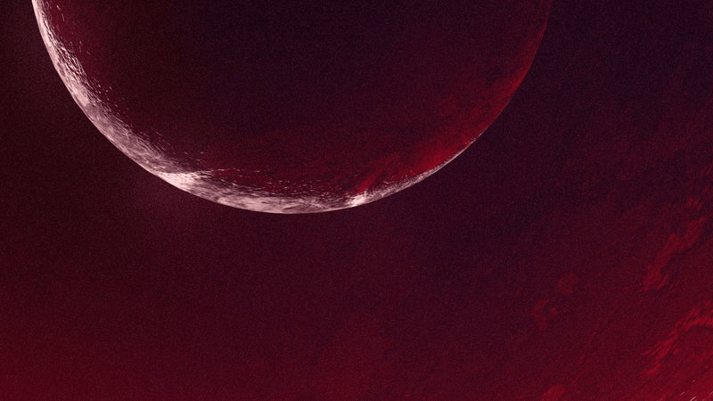 A crimson crescent on a dark red field