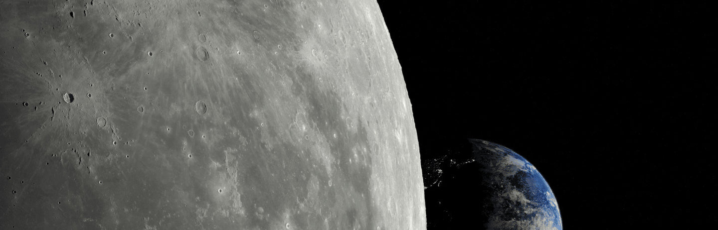 A large grey moon beside a small blue earth
