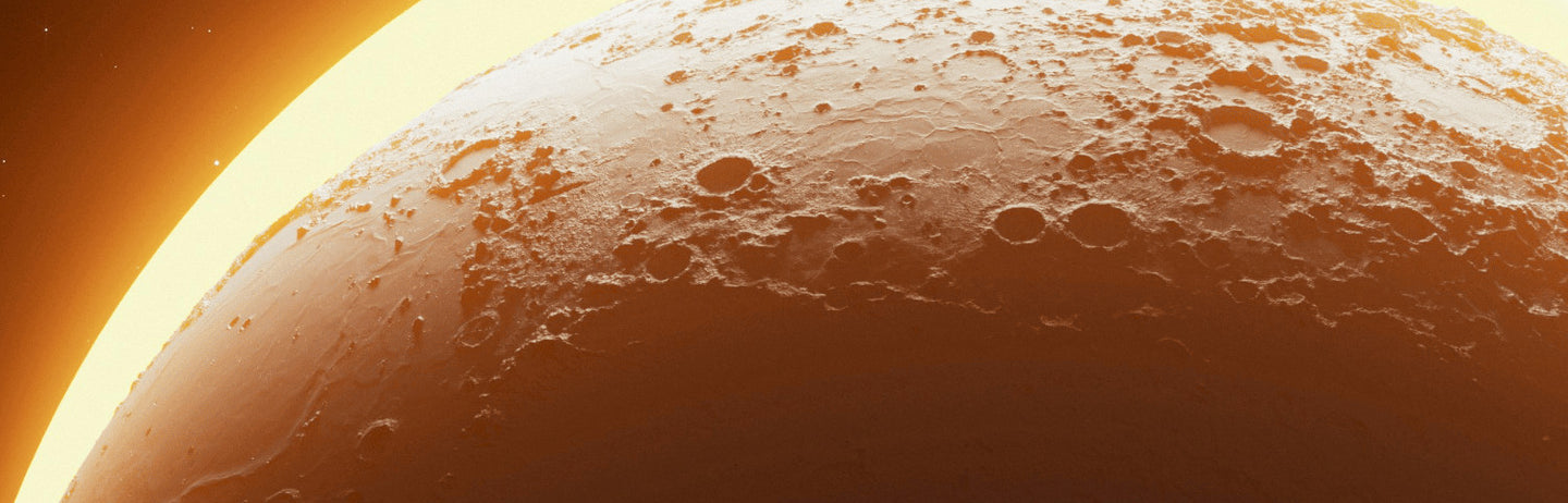 A large amber planet lit from above