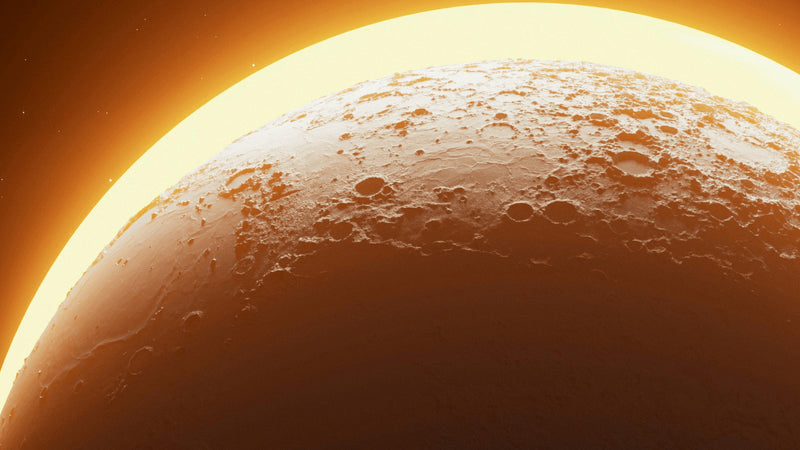 A large amber planet lit from above