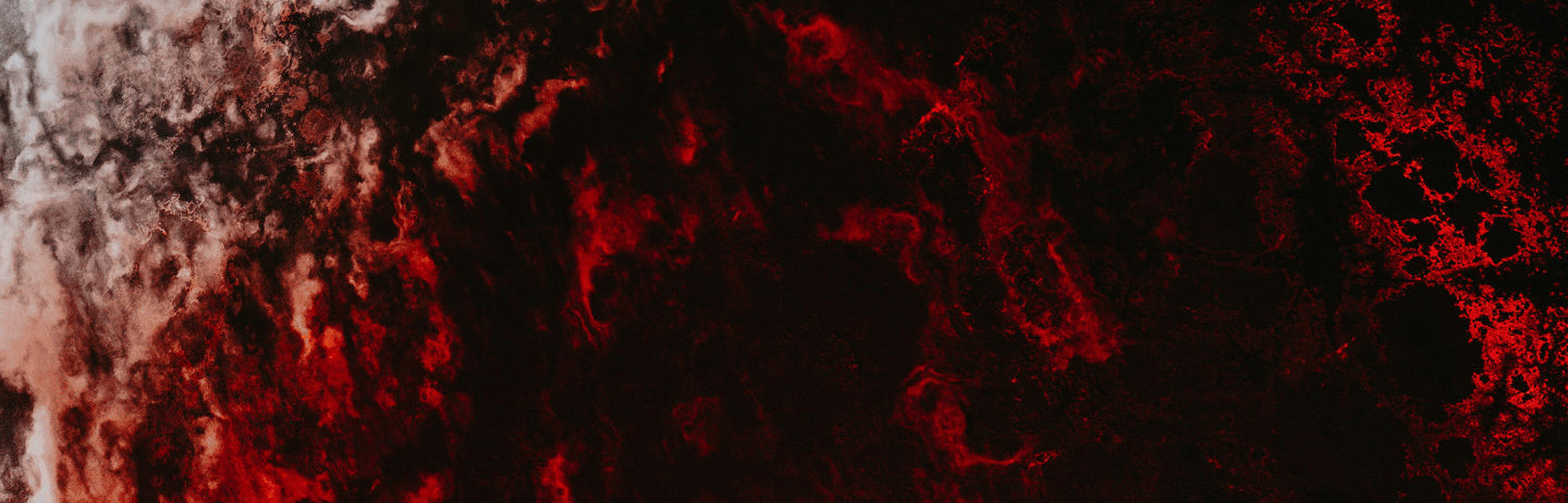Red lit rock against black
