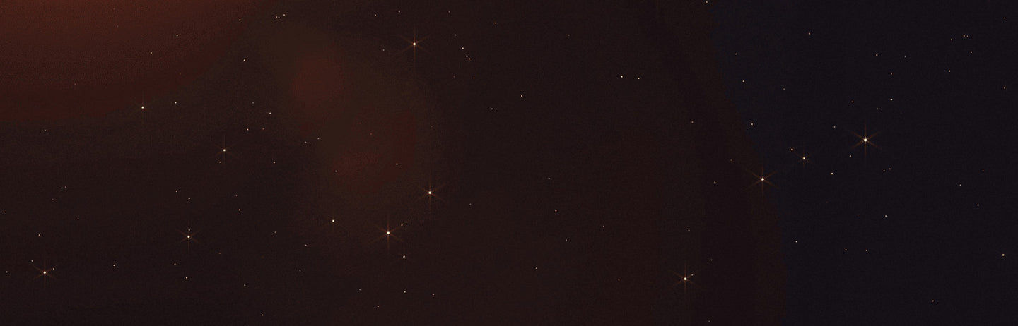 An orange glow above a dark field