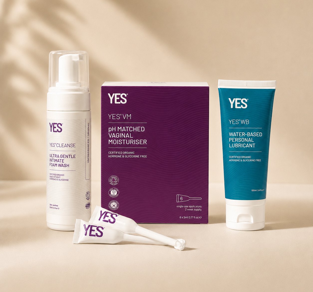 YES Cleanse foam wash, VM vaginal moisturiser and WB water-based lubricant on a cream background