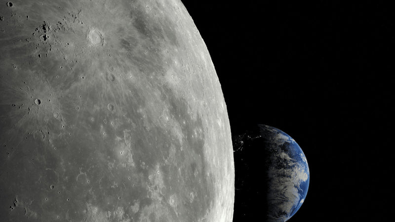 A large grey moon beside a small blue earth